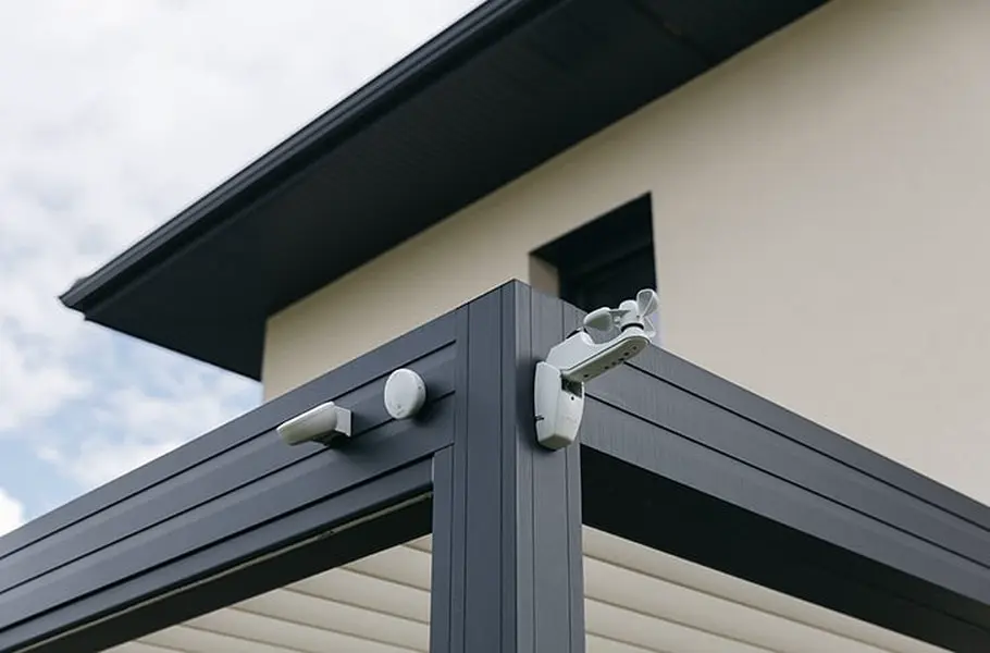 Somfy Eolis 3D wind sensor and sun sensor mounted on the corner of a pergola, specified by Custom Blinds Shutters & Awnings