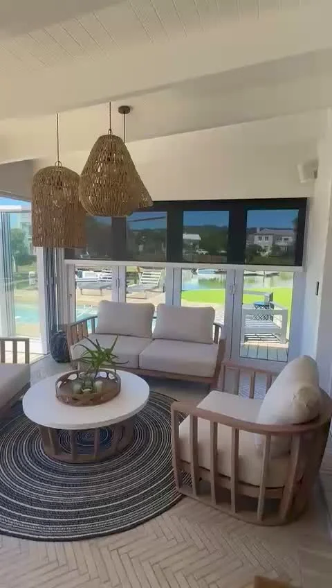 Motorised outdoor blinds lowering on a Garden Route patio, from Custom Blinds Shutters & Awnings' own footage