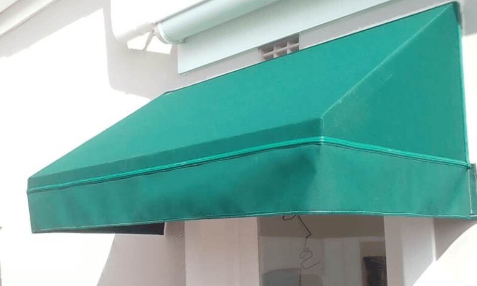 Wedge awning installation in Plettenberg Bay by Custom Blinds showing fabric and frame detail