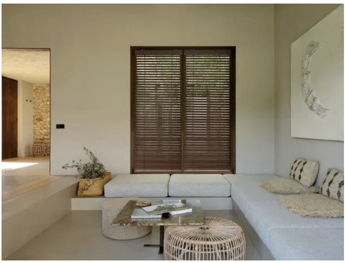 Bamboo venetian blinds in a South African lounge with built-in seating and natural light, Custom Blinds Shutters & Awnings