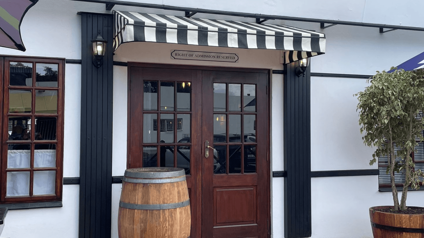 Wedge awning on restaurant frontage in the Garden Route installed by Custom Blinds