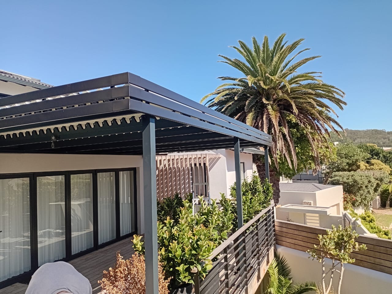 Louvred awning Beachy Head Drive Plettenberg Bay installed by Custom Blinds Shutters & Awnings