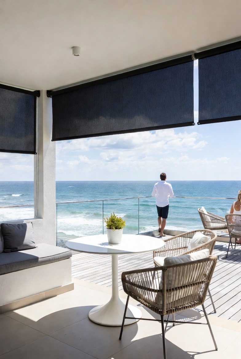 Outdoor blinds on a Sedgefield lagoon-side home by Custom Blinds
