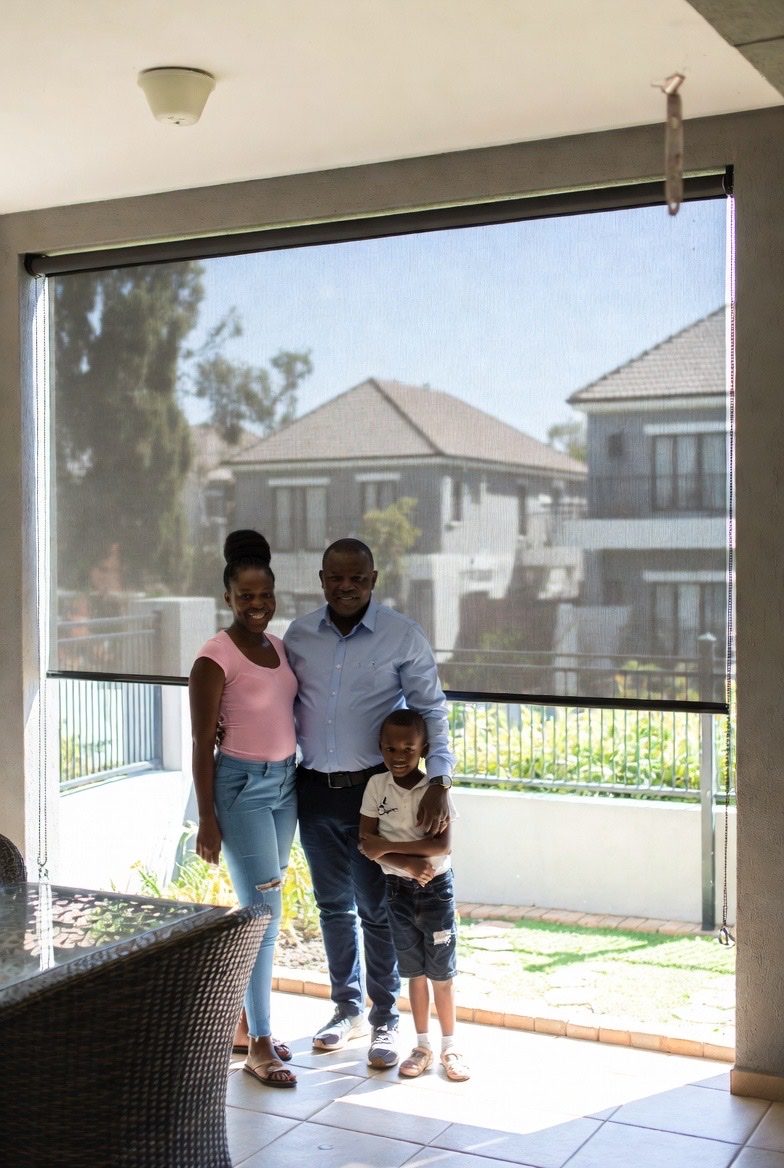 Family enjoying their patio with screen mesh outdoor blinds by Custom Blinds South Africa