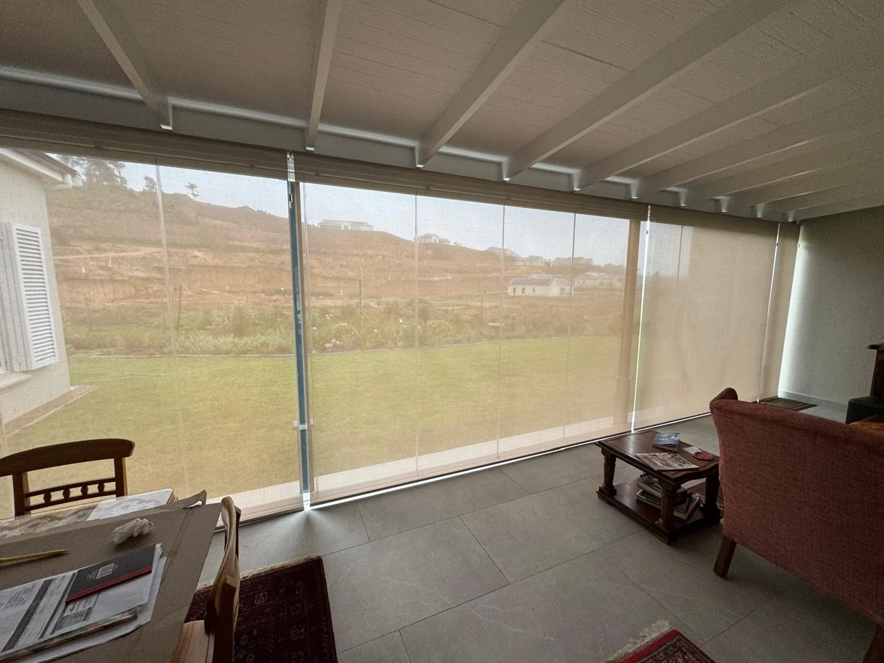 Sheer outdoor screen blinds expertly installed at Green Pastures Estate, Knysna, indoor view by Custom Blinds Shutters & Awnings, Garden Route, South Africa