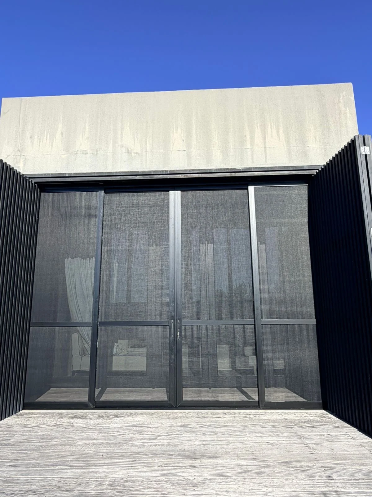 Symmetrical front elevation of Corner Star security and insect screens, installation at a Pezula Private Estate home, Knysna by Custom Blinds Shutters & Awnings, Garden Route, South Africa