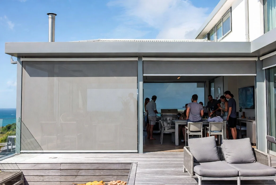 Outdoor blinds on a coastal Garden Route home with ocean views and an outdoor entertaining area by Custom Blinds Shutters & Awnings