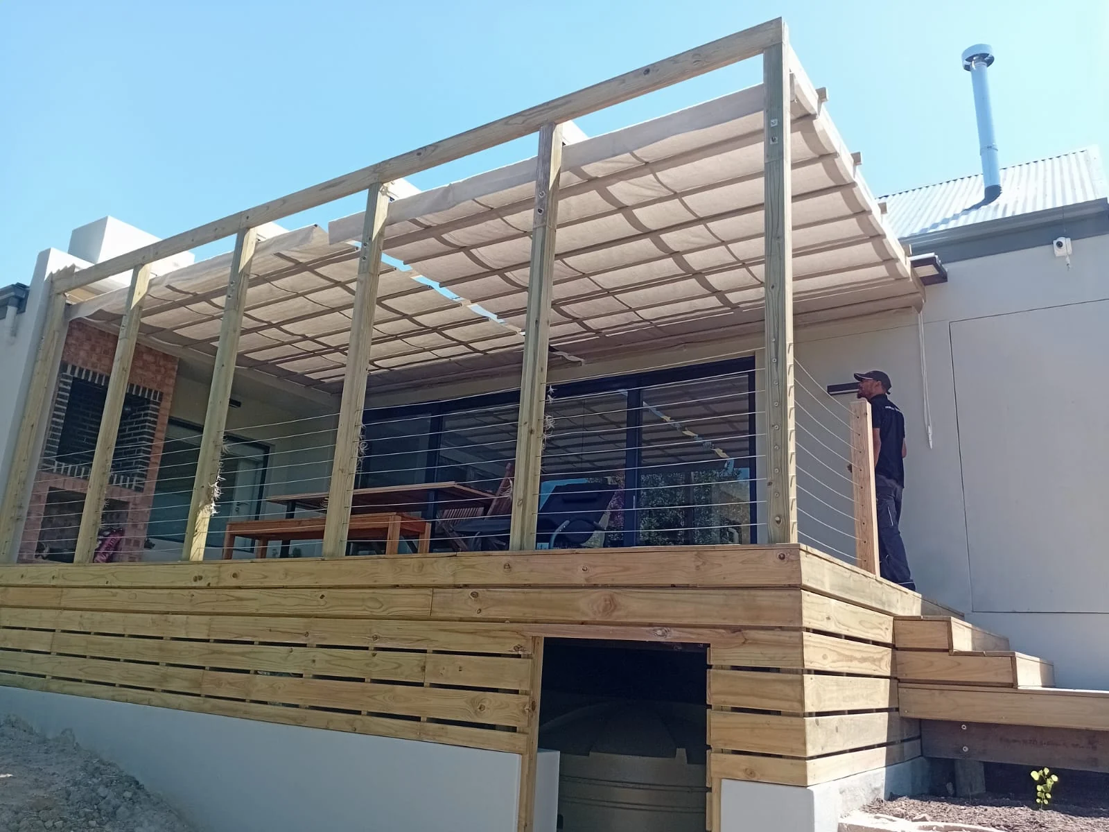 Retractable patio shade awning on timber deck at Westward Bridge Eco Estate Knysna, installed by Custom Blinds Shutters & Awnings, Knysna, Garden Route, South Africa