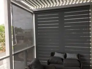 Custom Blinds South Africa Patio with stylish outdoor roller blinds for privacy and shade, plus comfy seating—perfect for relaxed South African living on Thesen Island Knysna . Garden Route & Online