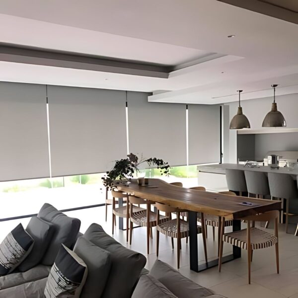 Roller blinds in blackout fabric darken the room and add an elevated ambiance