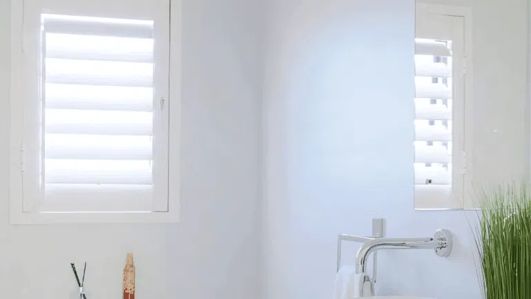 PVC shutters in a white bathroom — moisture-resistant shutter material for wet rooms in South Africa