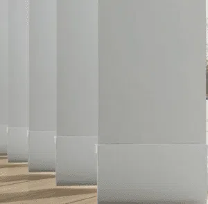 Custom Blinds South Africa Evenly spaced white columns cast gentle shadows on wooden floors, letting in gentle sunlight for a calm, stylish indoor look. Garden Route & Online