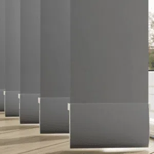 Custom Blinds South Africa Grey vertical blinds filter sunlight and create cool shadows, adding style and comfort to your home’s wooden floors. Garden Route & Online