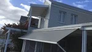 a grey fall arm awnings on thesen island knysna installed by Custom Blinds