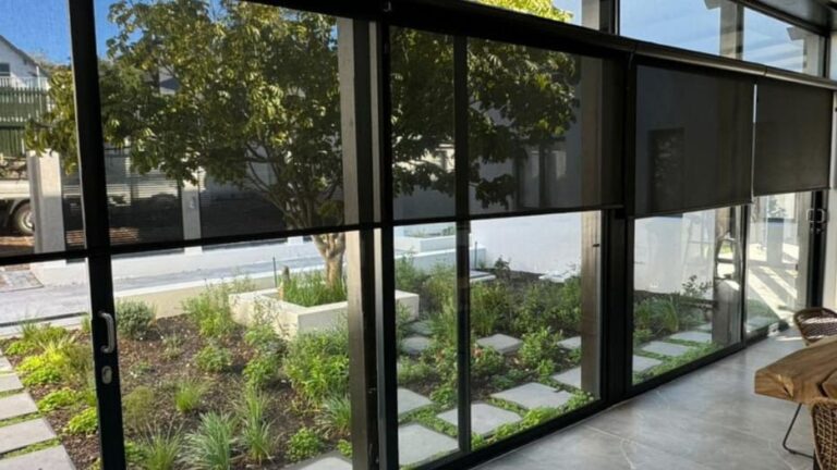 Sleek roller blinds in a modern South African interior showing clean lines and precise light control