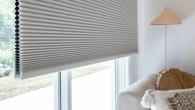 Duette-style honeycomb blinds showing cellular structure in a modern South African interior