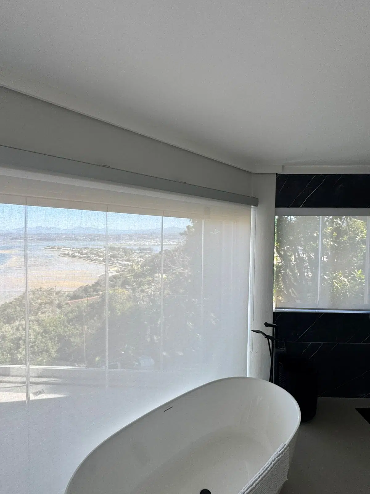 Roller blinds installed in a Knysna Heads home by Custom Blinds Shutters and Awnings