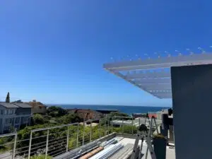 Large louvred awning installation on a Plettenberg Bay property by Custom Blinds