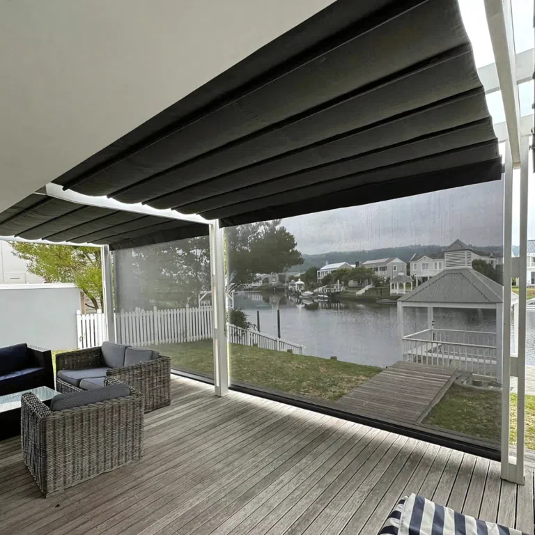 Custom outdoor blinds installed on a Thesen Island patio in Knysna, clear PVC with waterfront views