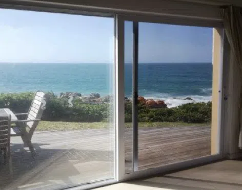 Fly screen door fitted to a Garden Route home — Custom Blinds