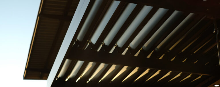 Charcoal louvred awning by Custom Blinds showing adjustable aluminium blades