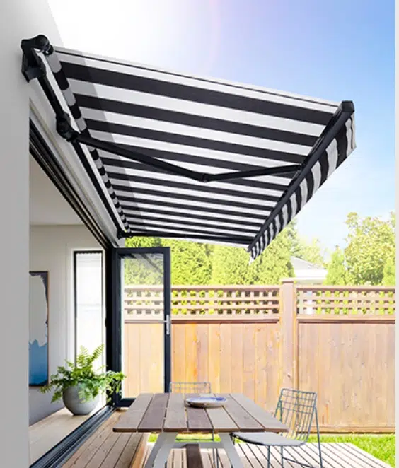Striped retractable folding arm awning with Somfy motorisation