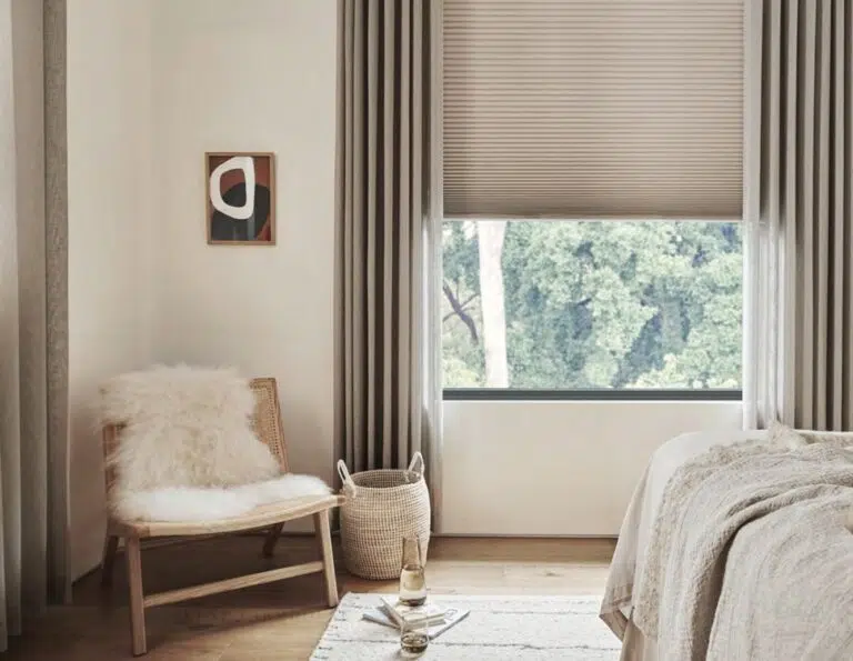 Honeycomb blinds filtering light in a modern living room