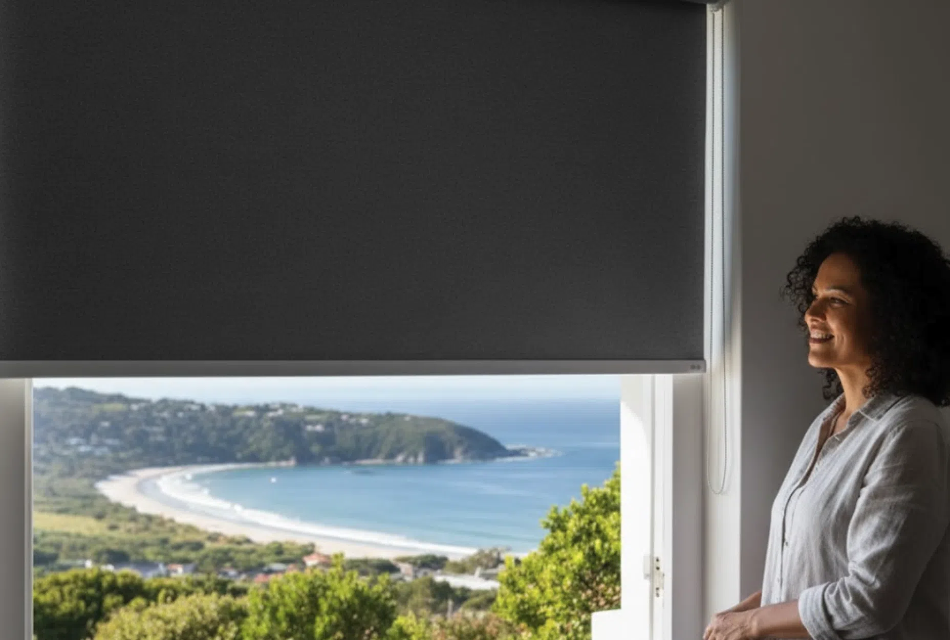 No-drill blockout roller blind installed in a South African bedroom with tension-mount frame from Custom Blinds Shutters and Awnings, no screws or wall damage