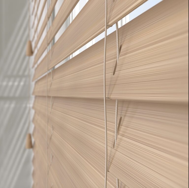 Plaswood venetian blind slat showing realistic wood grain texture and UV-resistant composite material