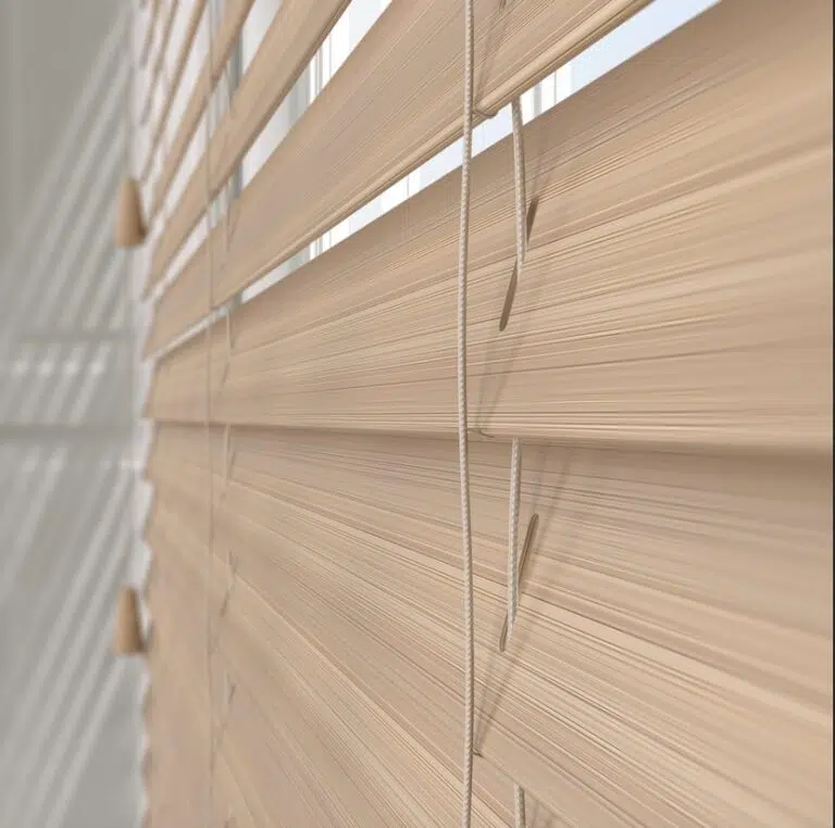 Plaswood venetian blind slat showing realistic wood grain texture and UV-resistant composite material