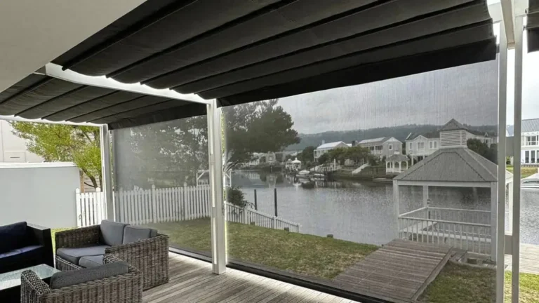 Screen fabric outdoor blinds and retractable awning on a South African patio with mountain views