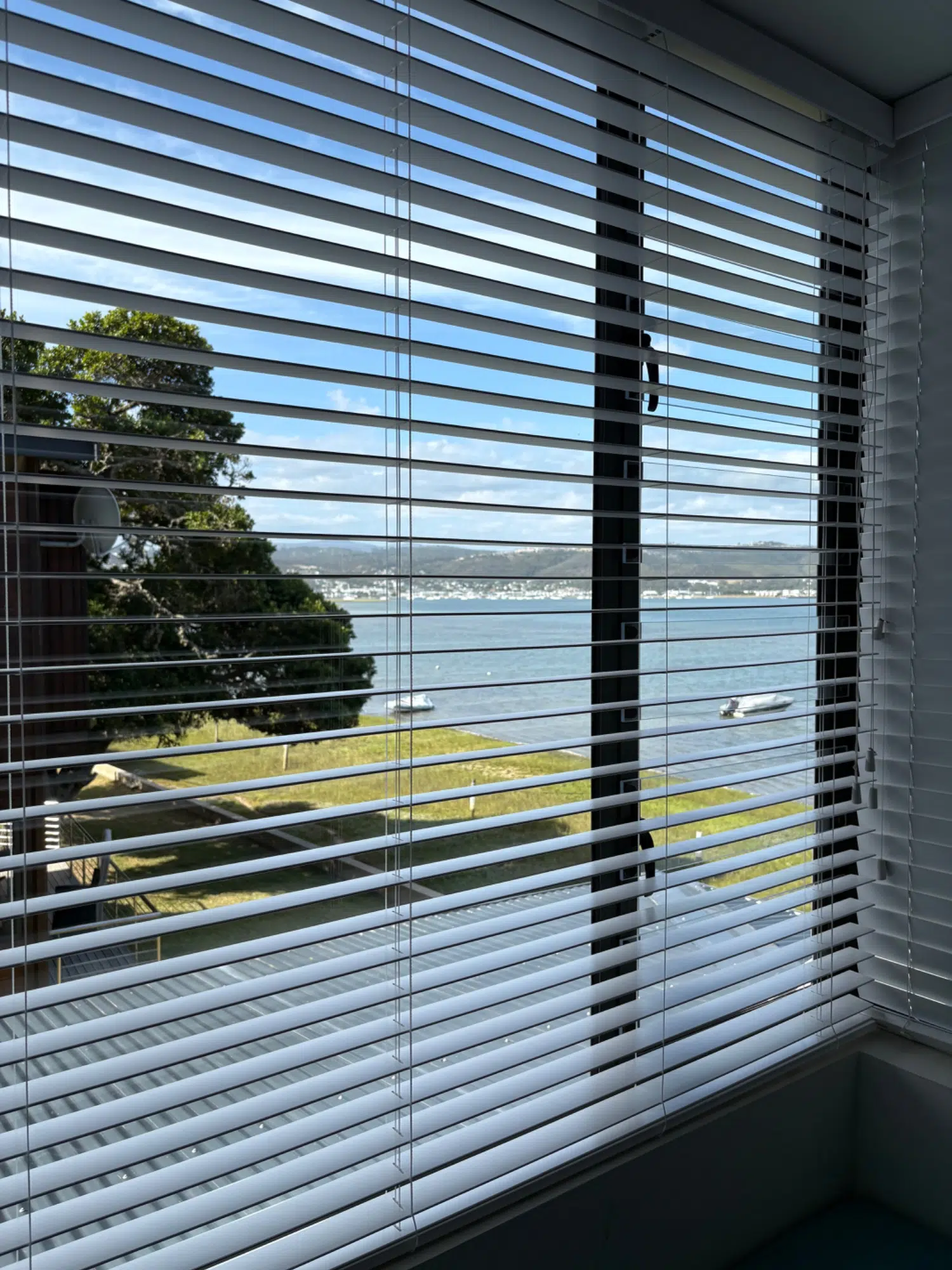 Aluminium venetian blinds filtering light with lagoon views, Brenton on Lake, Knysna