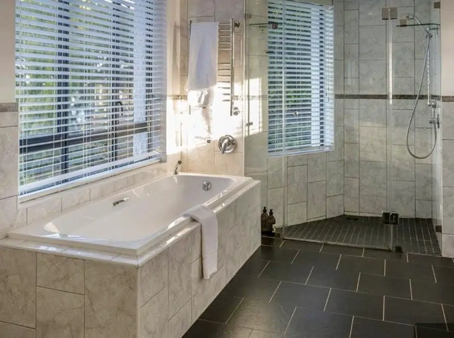 Plaswood venetian blinds in marble bathroom at Cambalala Guesthouse Knysna