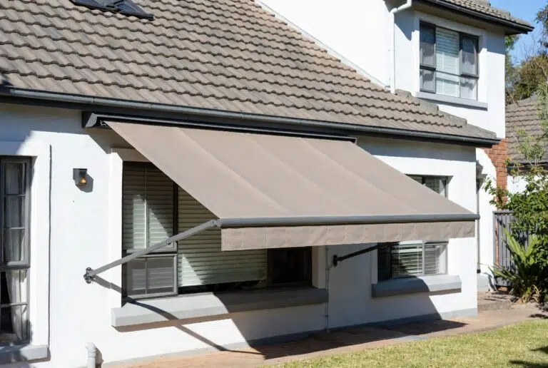 Fall arm drop arm awning with acrylic canvas fabric installed on a George home, Garden Route by Custom Blinds