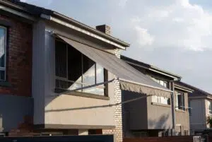 Fall arm awning shading windows on a Plettenberg Bay coastal property