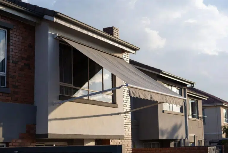 Multiple fall arm awnings installed on adjacent residential properties on the Garden Route by Custom Blinds