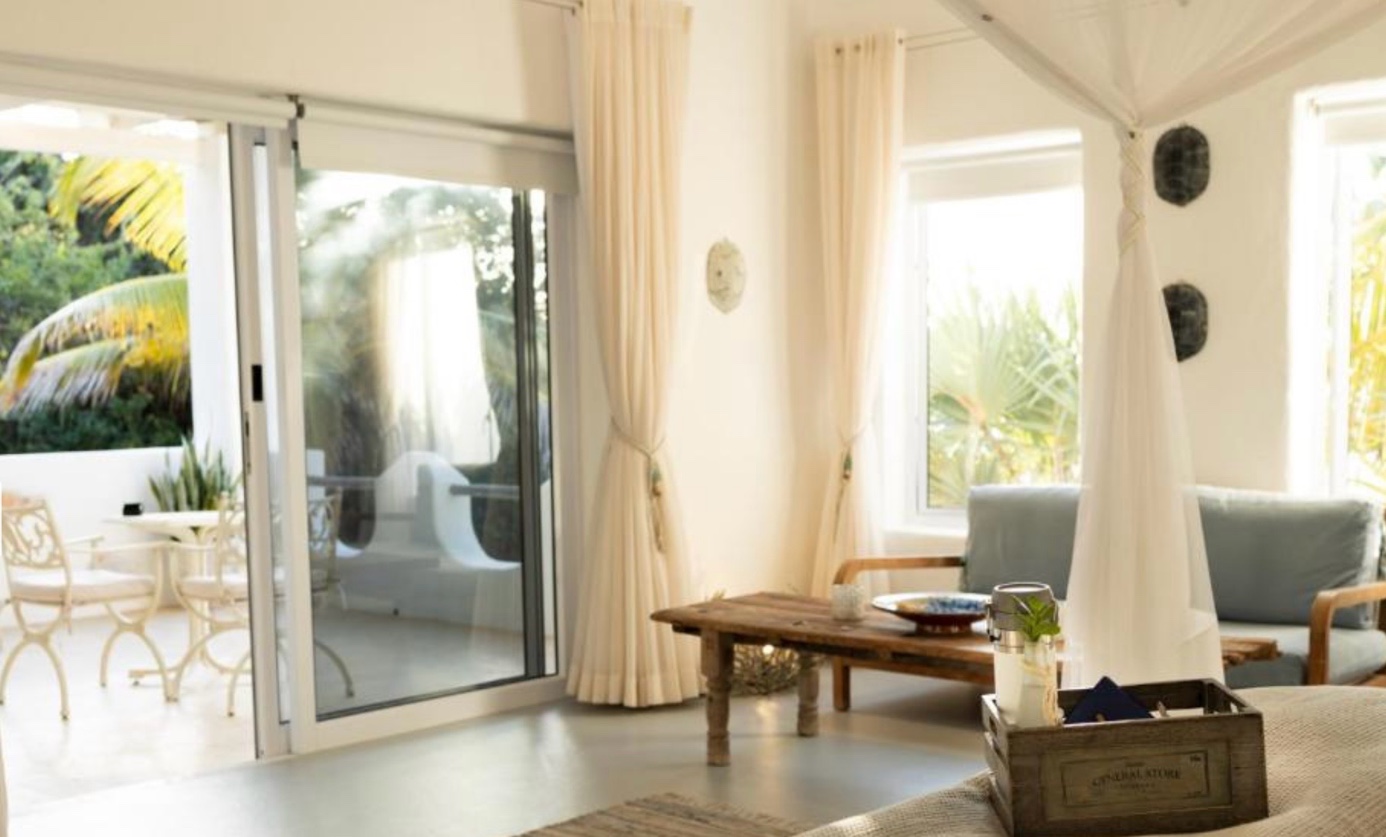 Roller blind on a sliding door in a resort living area, coastal Mozambique
