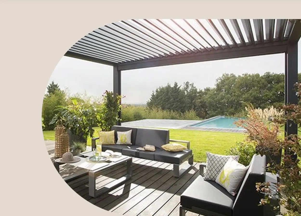 Somfy automated louvre awning over outdoor living area with pool, specified and installed by Custom Blinds Shutters and Awnings Garden Route