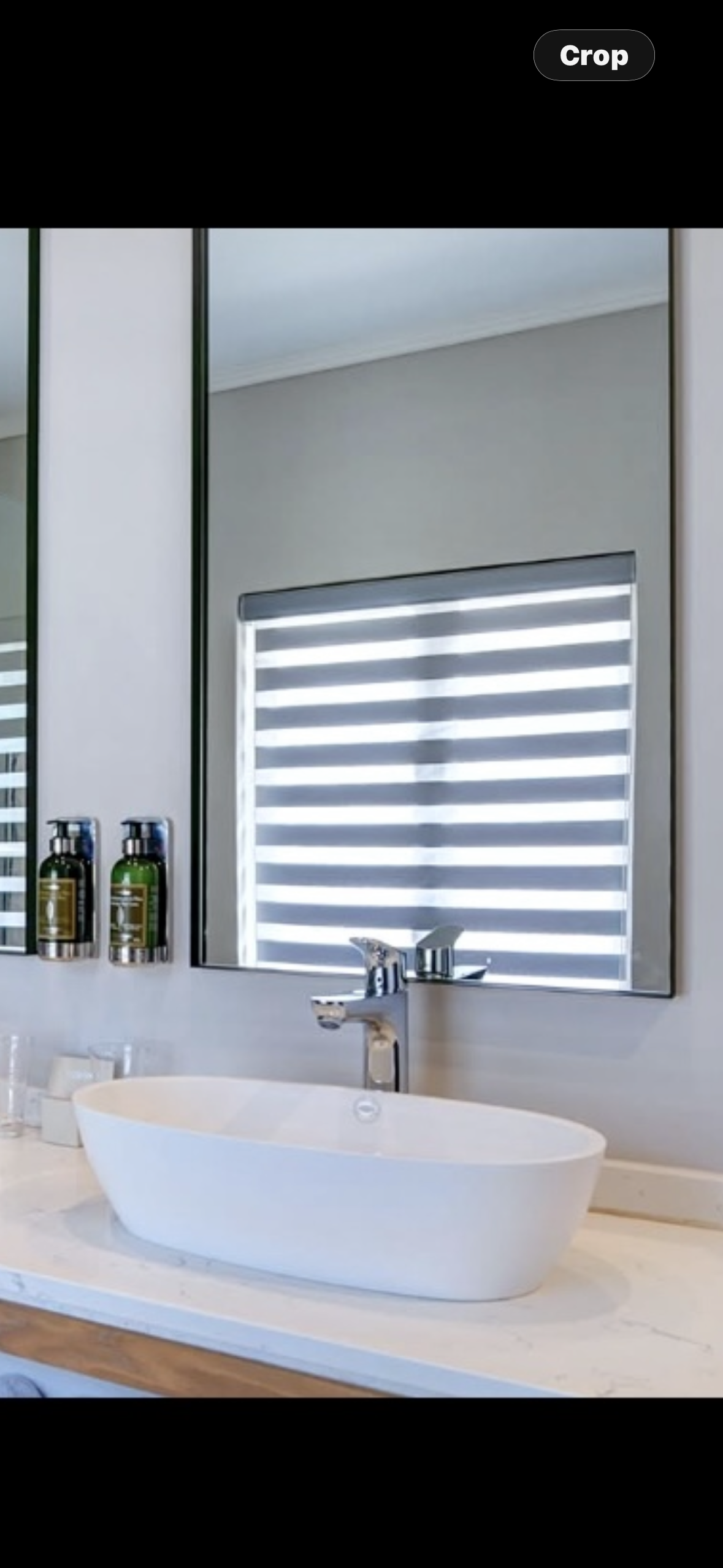 Zebra double roller blind in a bathroom — day-night blind reflecting in mirror, Custom Blinds South Africa