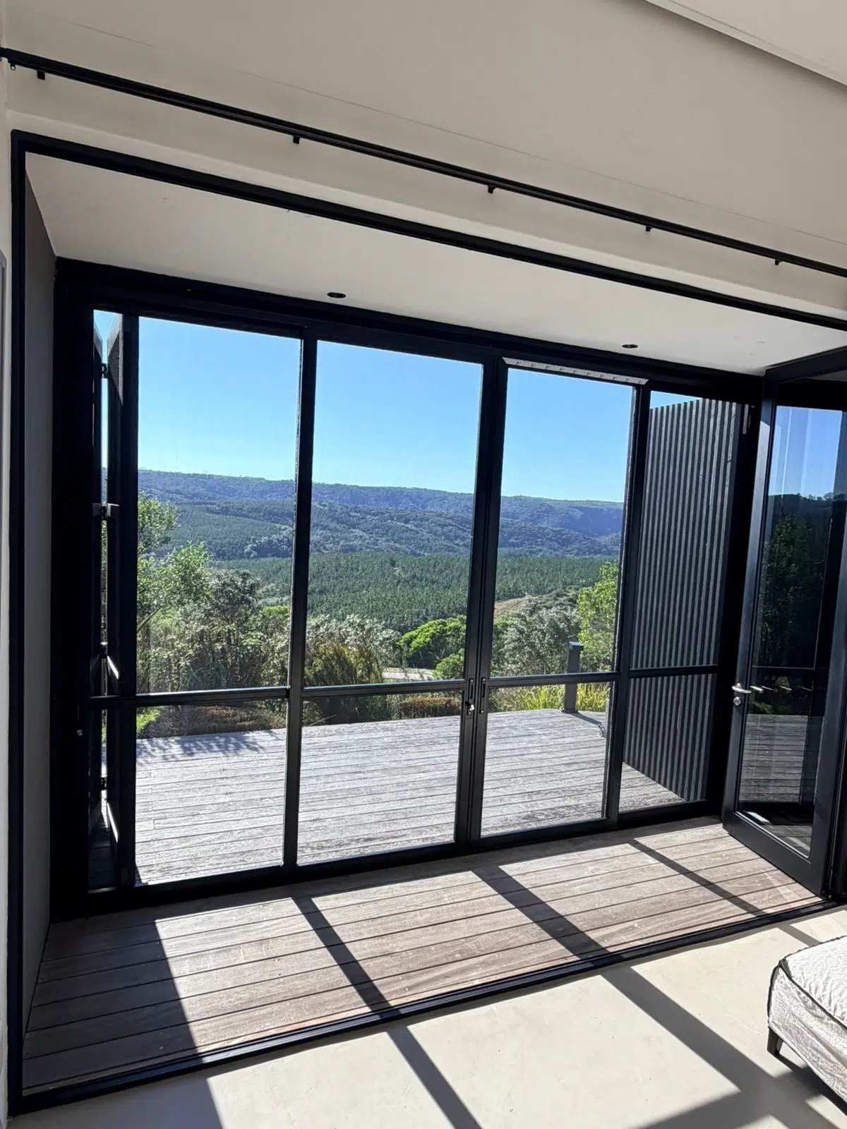 Clean exterior view of Corner Star fly and insect screens at a Pezula Private Estate home in Knysna, Garden Route — installed by Custom Blinds