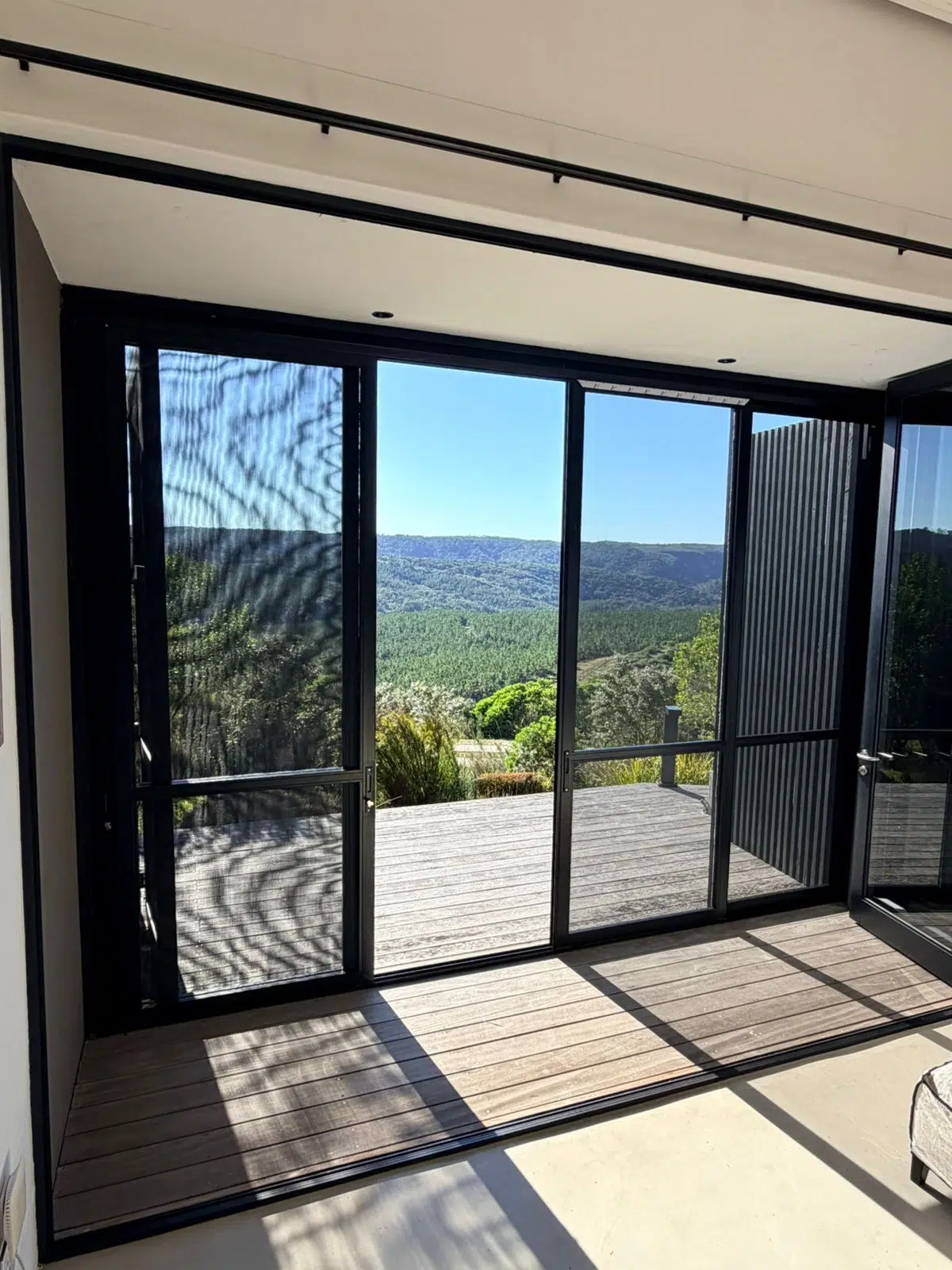 Close mesh detail of Corner Star security and insect screens fitted over sliding doors, installed by Custom Blinds at a Pezula home, Knysna, Garden Route