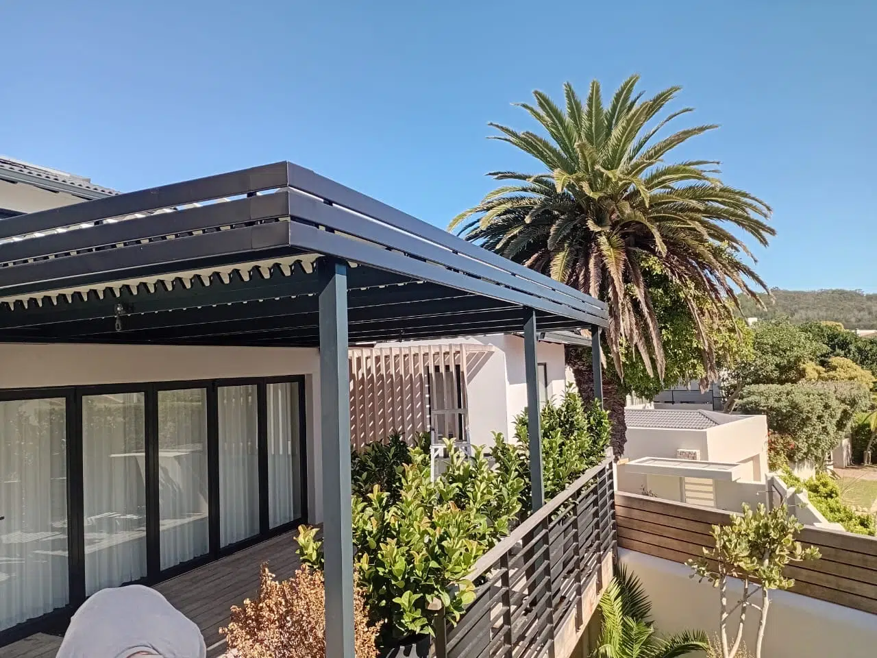 Adjustable aluminium louvred patio awning by Custom Blinds, Beachy Head Drive, Plettenberg Bay