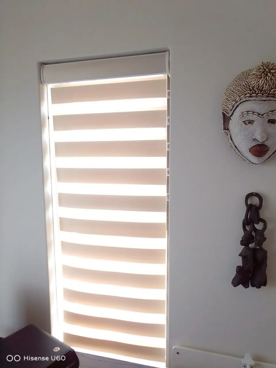 Zebra blinds with alternating sheer and opaque bands installed in a coastal home interior in Buffalo Bay. Custom Blinds Shutters and Awnings.