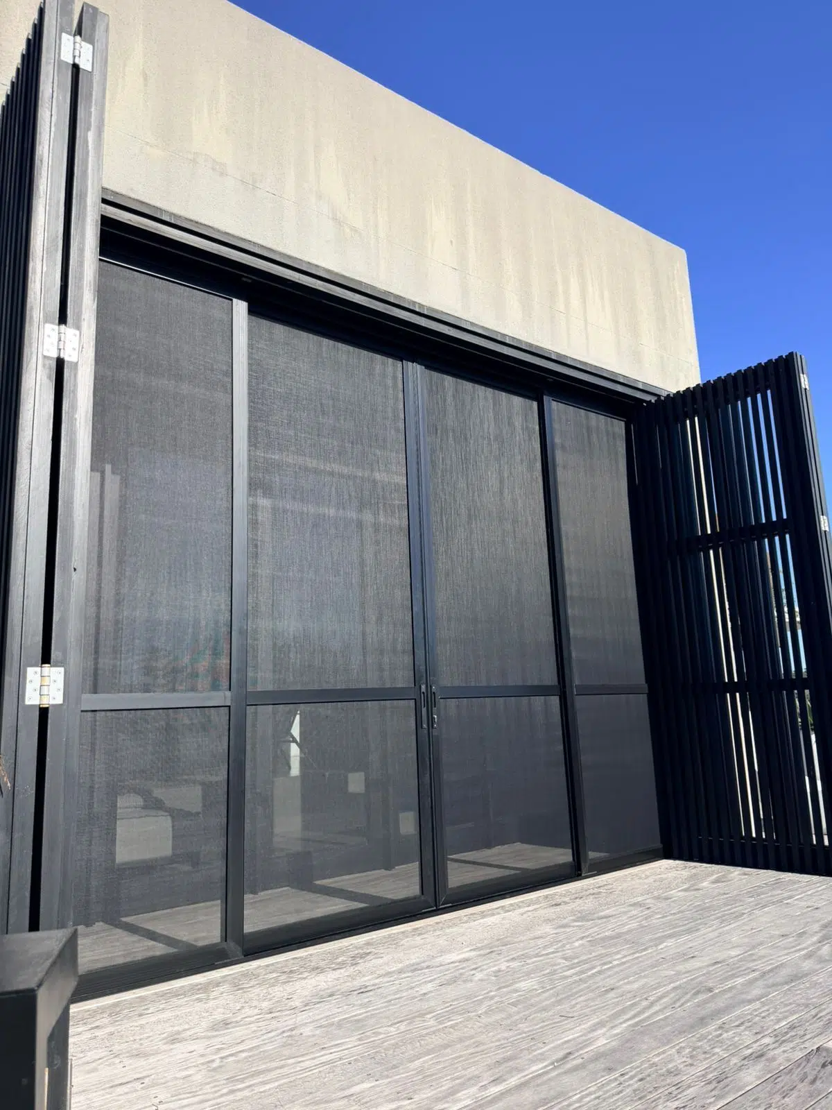 Full height sliding mesh screens on a patio opening, Pezula Private Estate