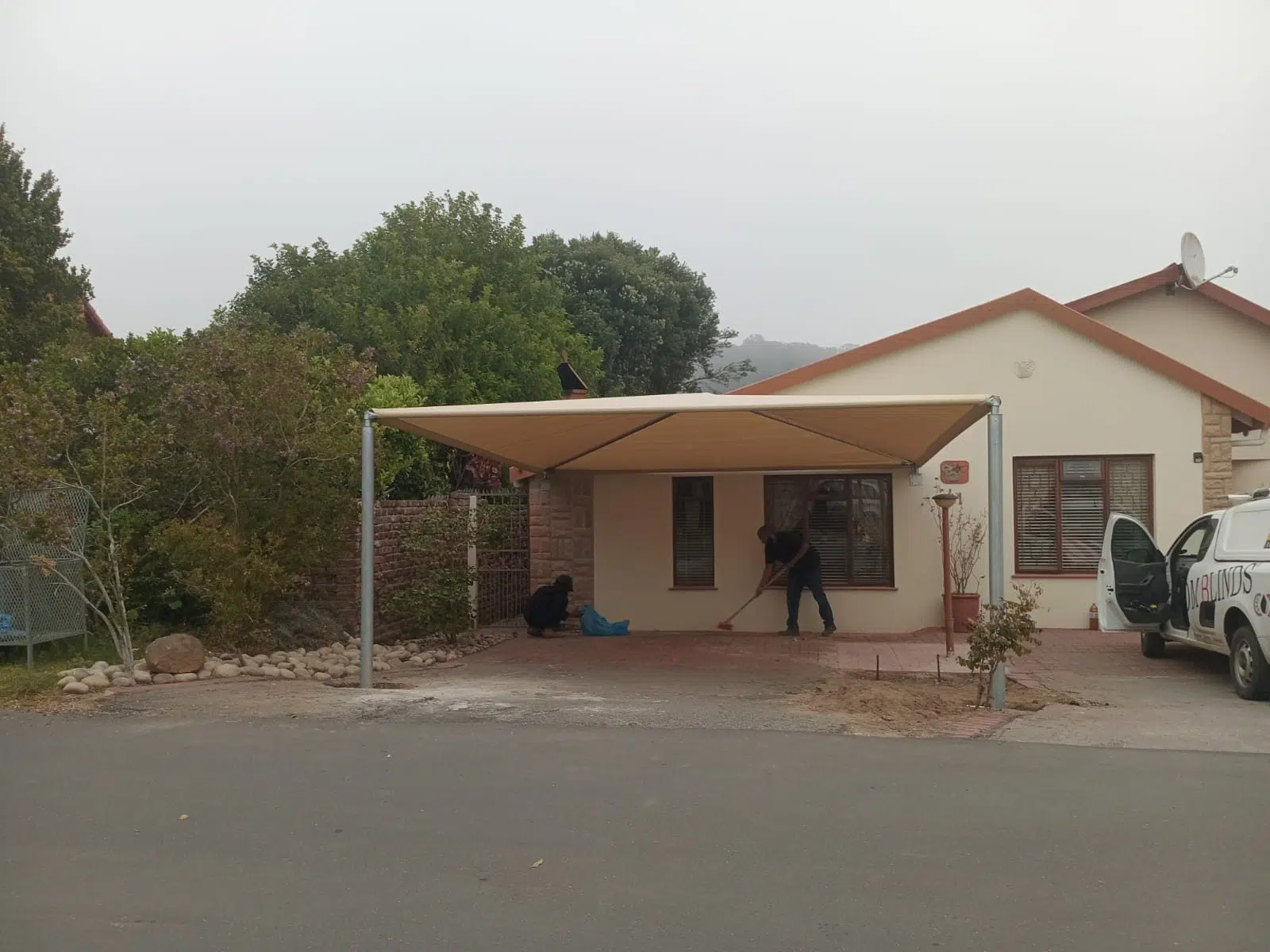 Completed shadeport covering a driveway in Plettenberg Bay | Custom Blinds Shutters and Awnings